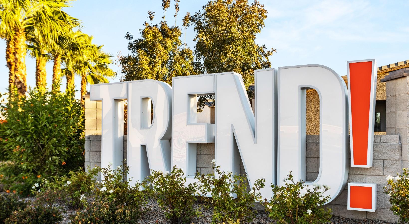 Settle into comfort at Trend! a white building with red doors