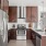 a kitchen with a stainless steel refrigerator