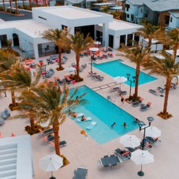 exterior of apartment with multiple outdoor swimming pools