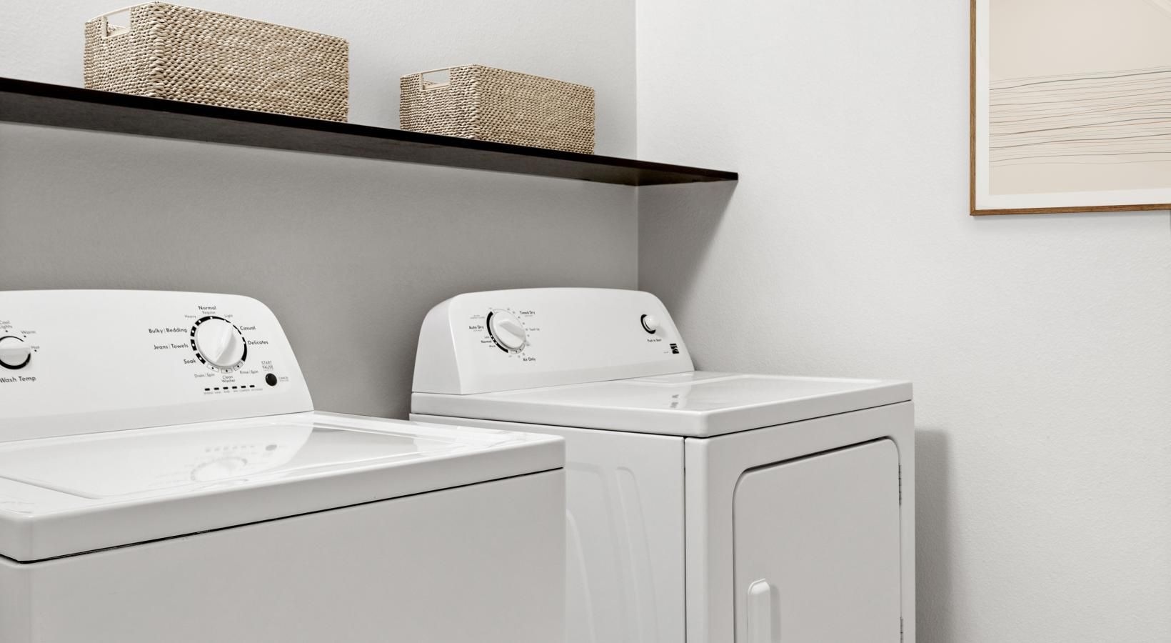 Laundry has never been easier a white washer and dryer in a room
