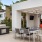 a patio with a table and chairs