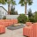 a couple of red couches in a backyard