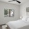 a bedroom with a large window