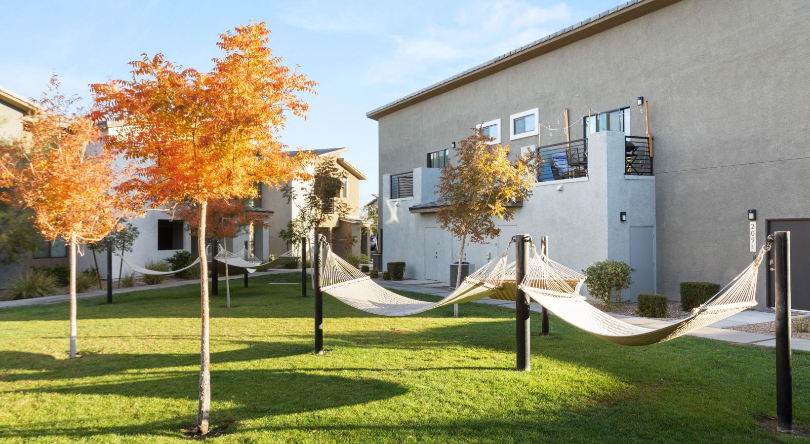 The essence of exceptional living a building with trees and grass