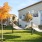 a building with trees and grass