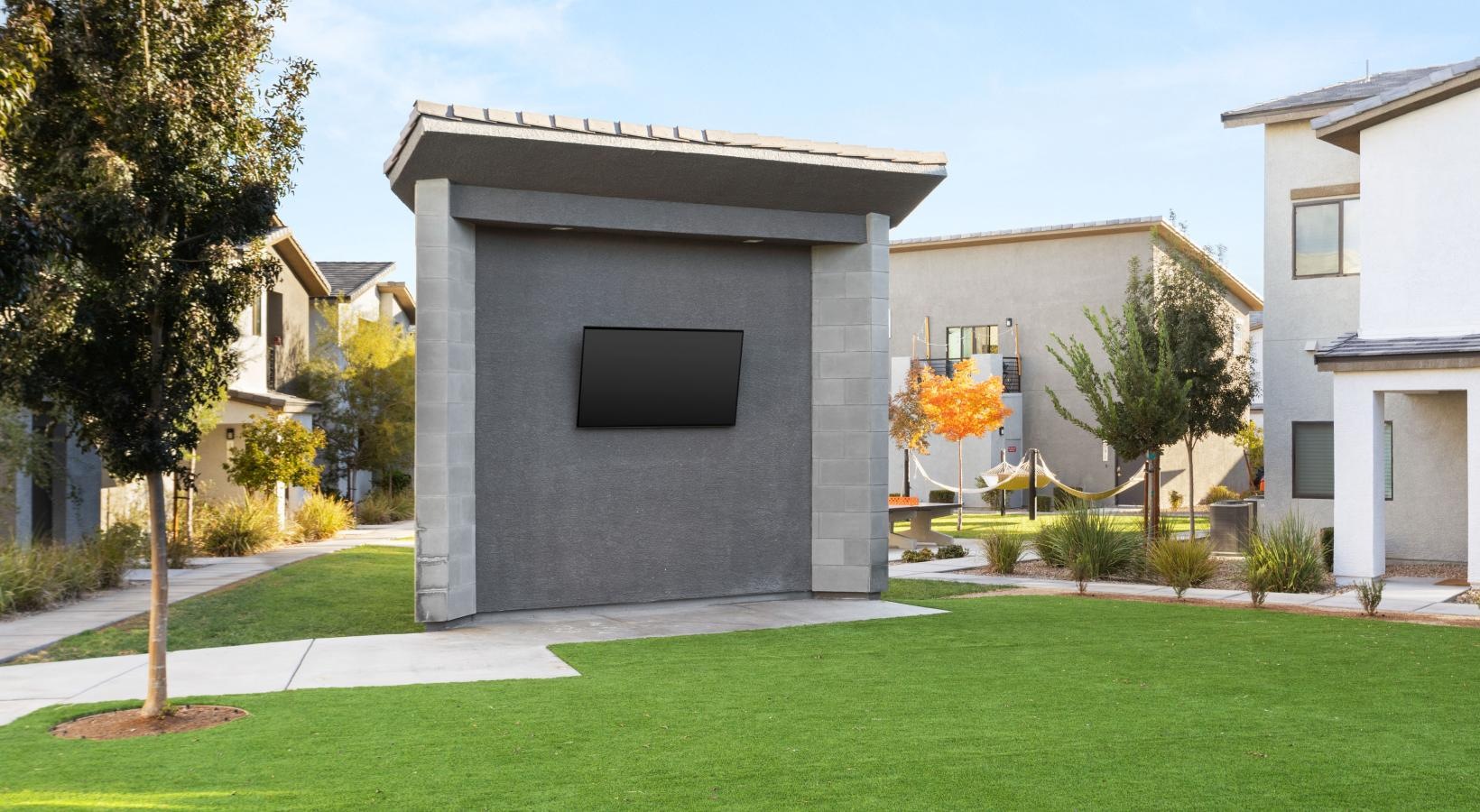 The essence of exceptional living a grey house with a green lawn