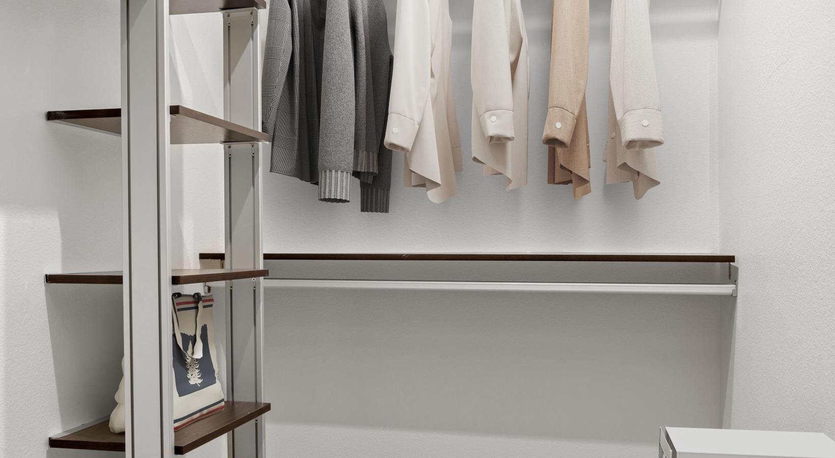 Settle into comfort at Trend! a white room with a shelf and a white wall with a white wall