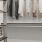 a white room with a shelf and a white wall with a white wall